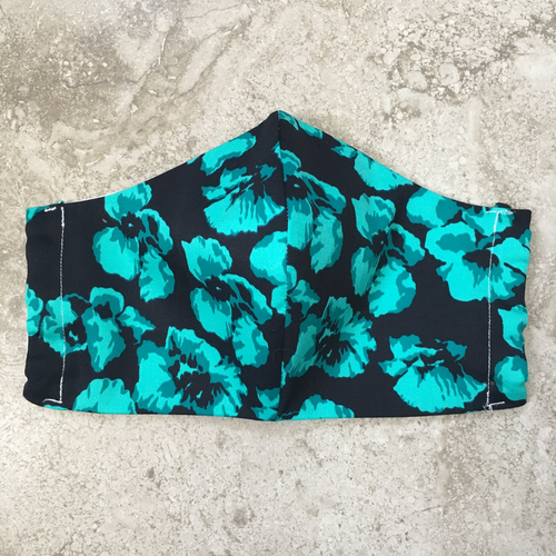 Teal Green Turquoise abstract floral print over black background face mask